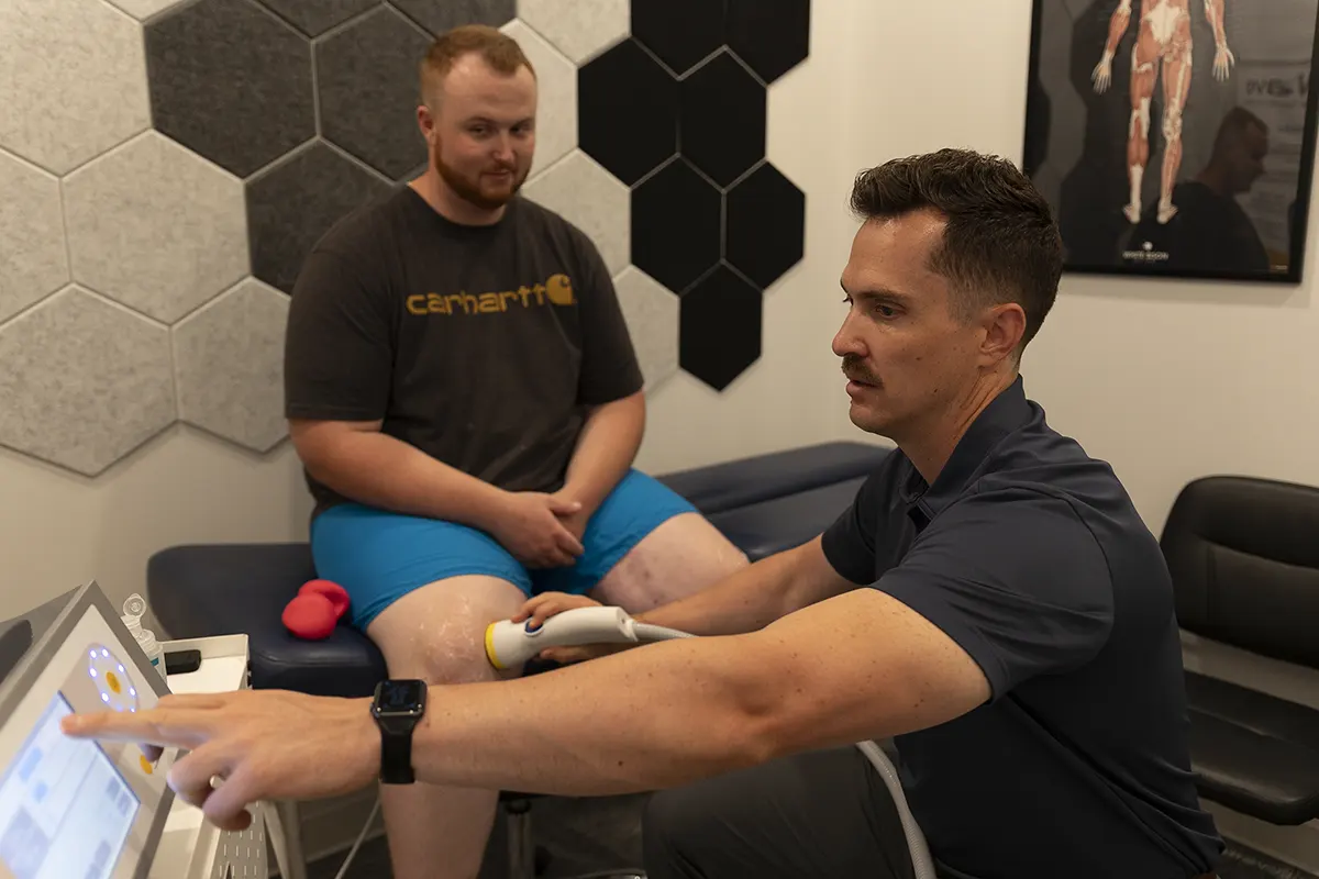 Dr. Travis Arrington providing SoftWave therapy