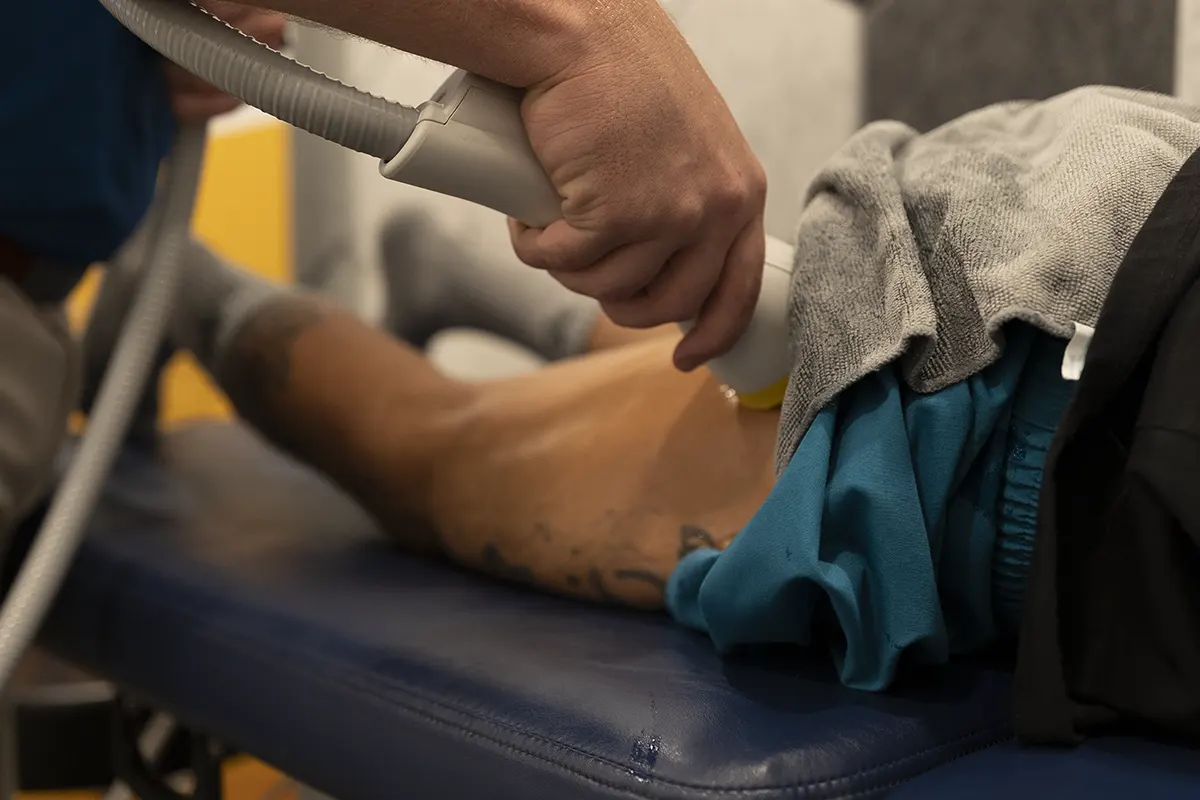 SoftWave therapy applied to a patient’s knee